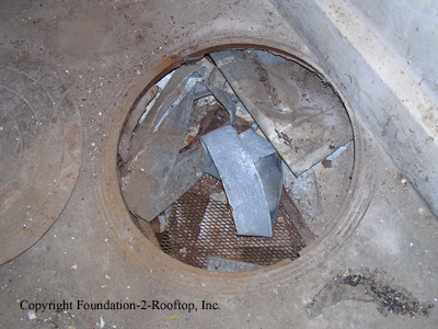 Old cistern in basement full of asbestos wrap.
