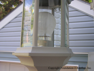 Exterior light installed upside down and holding water.