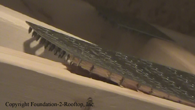 Floor truss with the teeth pulling the wood out of the truss.