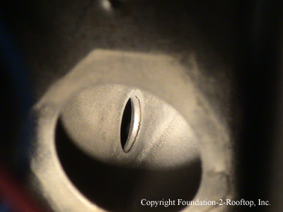 Cracked Serpentine heat exchanger around an eyelet.