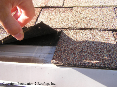 New roof, but they forgot to double up the bottom row to prevent ice-damming and water penetration.