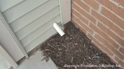 Sump pump discharge line improperly installed by Builder.