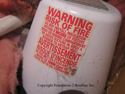 Warning label on the uninsulated canned light.