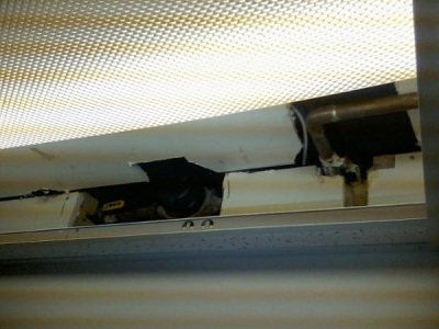 Water main was hidden above the drop ceiling recessed back into the drywall.